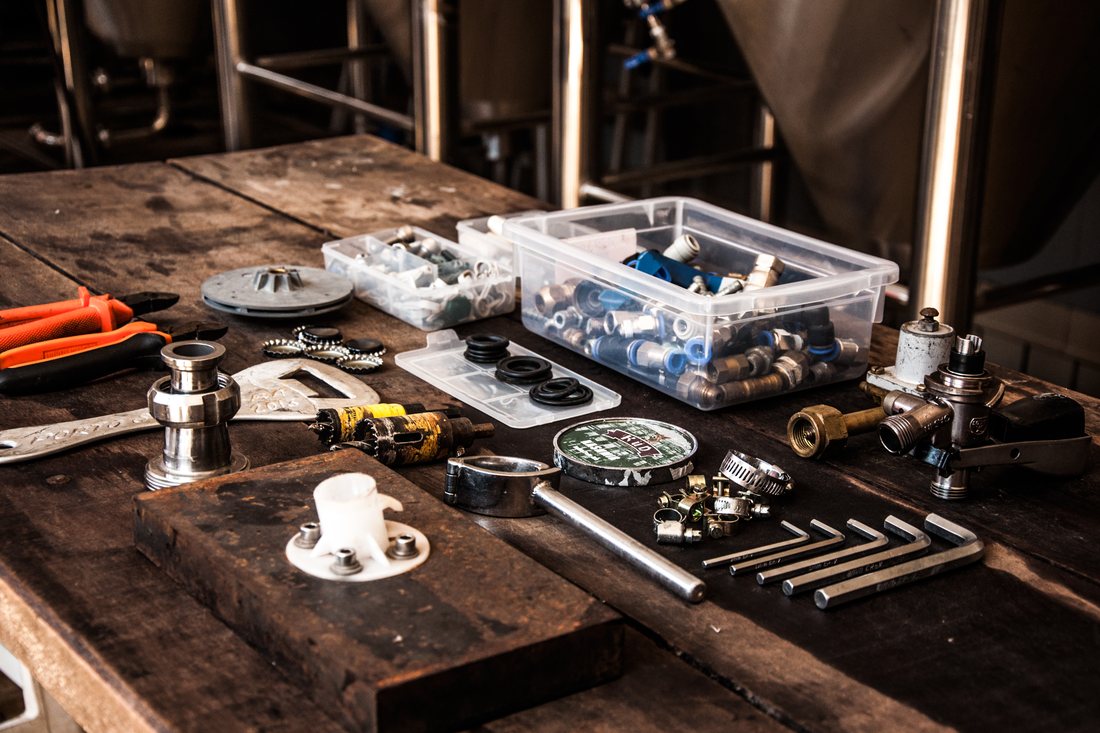 A workbench of plumbing parts